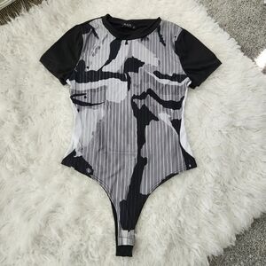 Julia Soft Stretchy Short Sleeve Bodysuit. Size Medium. New without tags.